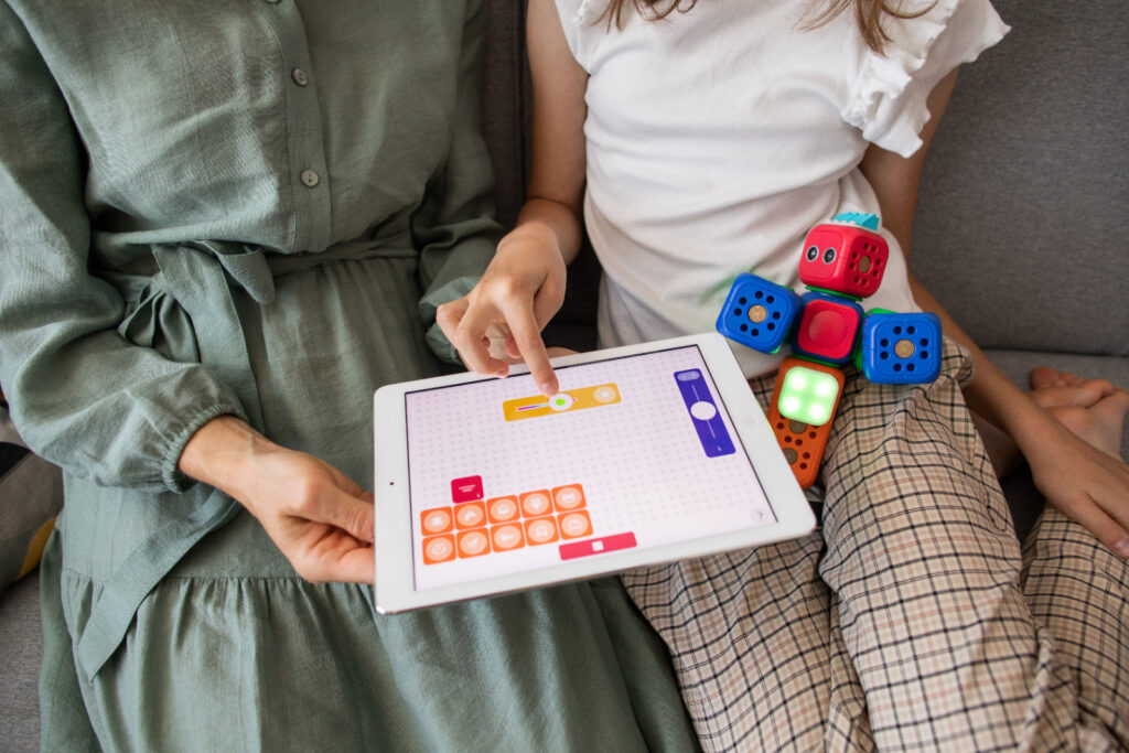 Child exploring STEM coding toys at home